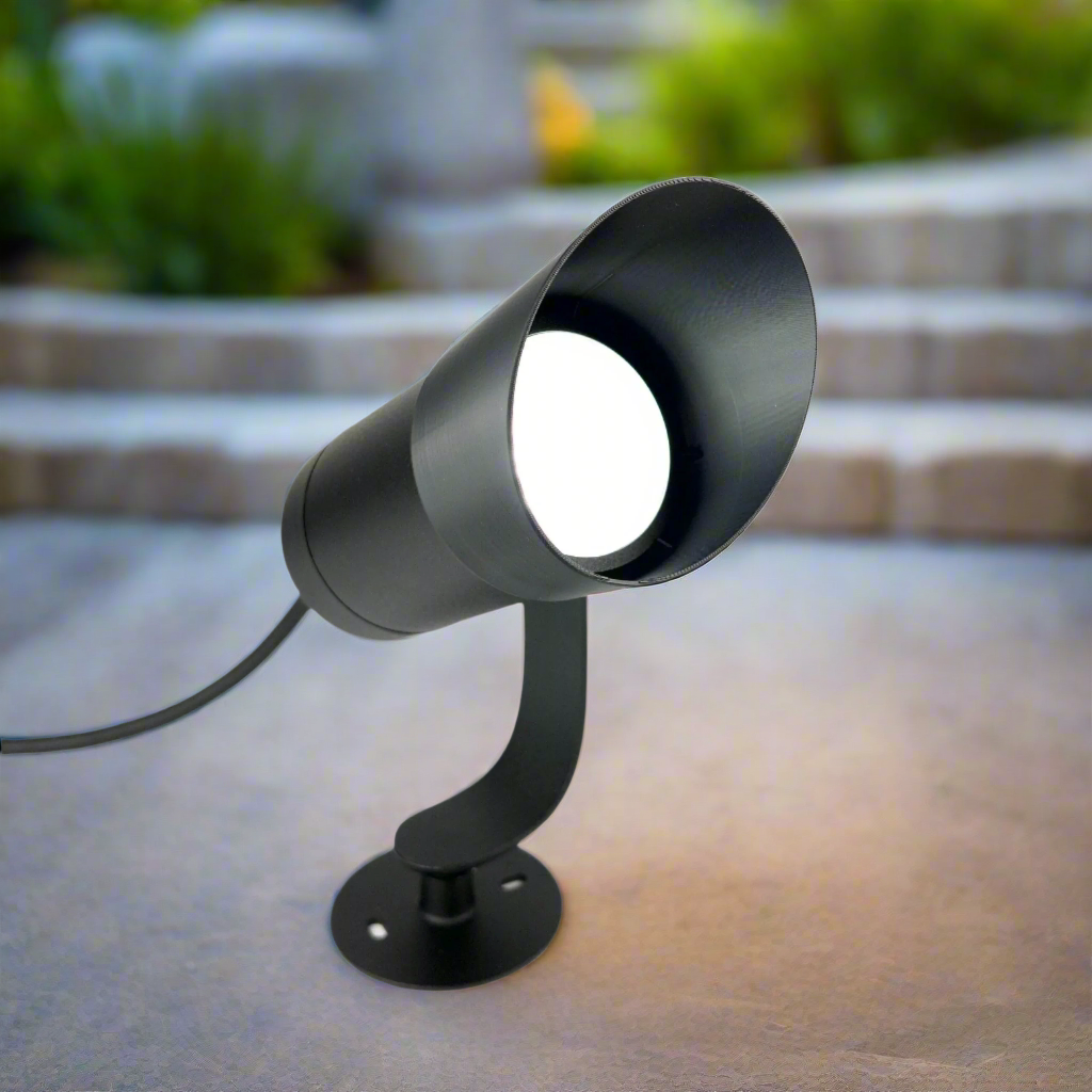 Anti Glare Shield for Philips Hue Lily outdoor spotlight, angled view in backyard