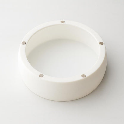 Back view of a white Glow Dome light diffuser on a plain background, showing the inner opening and embedded magnets used to attach to magnetic light trims.